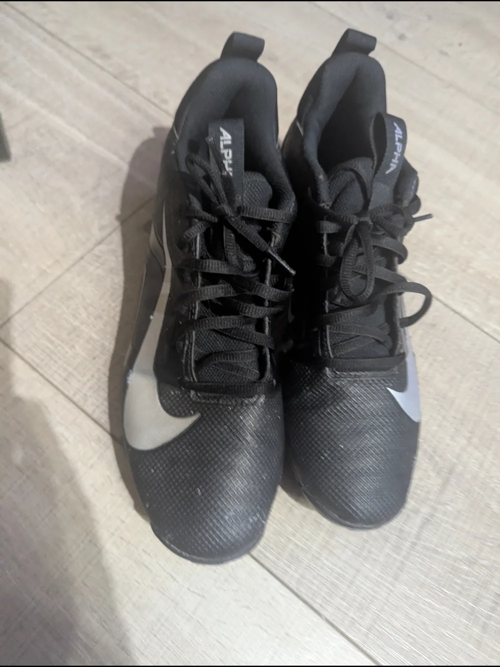 Nike Men’s Black Sneakers Cleats with Silver Swoosh